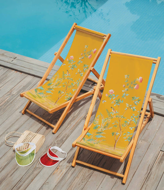 Deckchair with yellow fabric with floral pattern